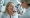 mature woman receiving a dermatological check-up to fade sun damage and assess skin condition.