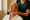 a spa professional giving a relaxing facial massage to an older woman at genesis medspa.
