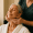 A spa professional giving a relaxing facial massage to an older woman at Genesis Medspa.