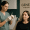 A medical professional preparing an injectable treatment while a client sits ready at Genesis Medspa.