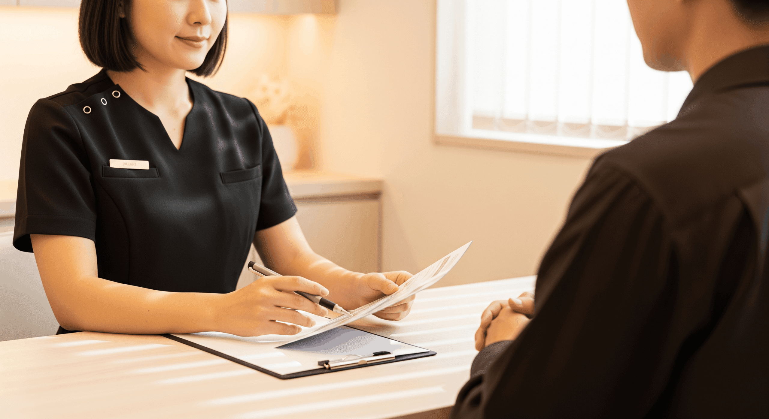 medical spa staff reviewing intake forms with a client during consultation
