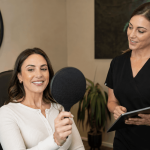Client viewing aesthetic treatment results in a handheld mirror