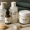 Collection of skincare products labeled for different skin types on a towel