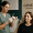 A medical professional preparing an injectable treatment while a client sits ready at Genesis Medspa.