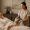 A woman receiving a laser hand treatment at Genesis Medspa.