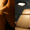 Split image of a woman’s shoulder and an LED light therapy chair in a